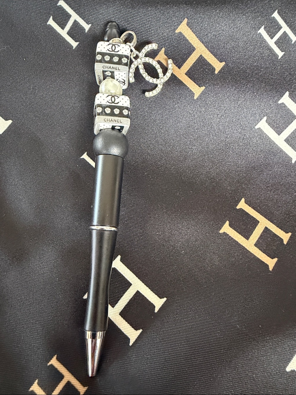 Black pen with beads and Silver charm